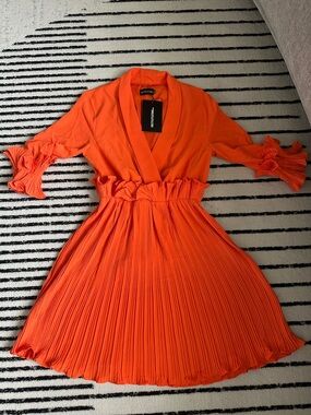3/4 sleeve Elegant Orange Pleated Women’s Dress with ruffles.